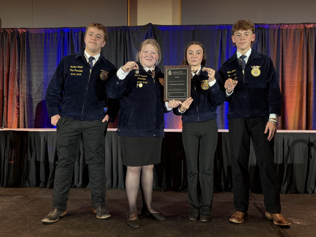 Team members pose for a picture at the 98th National FFA Convention & Expo livestock evaluation awards ceremony.