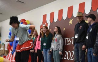 Ethan Sheets (on the left) performing at talent show at an Indiana FFA conference.