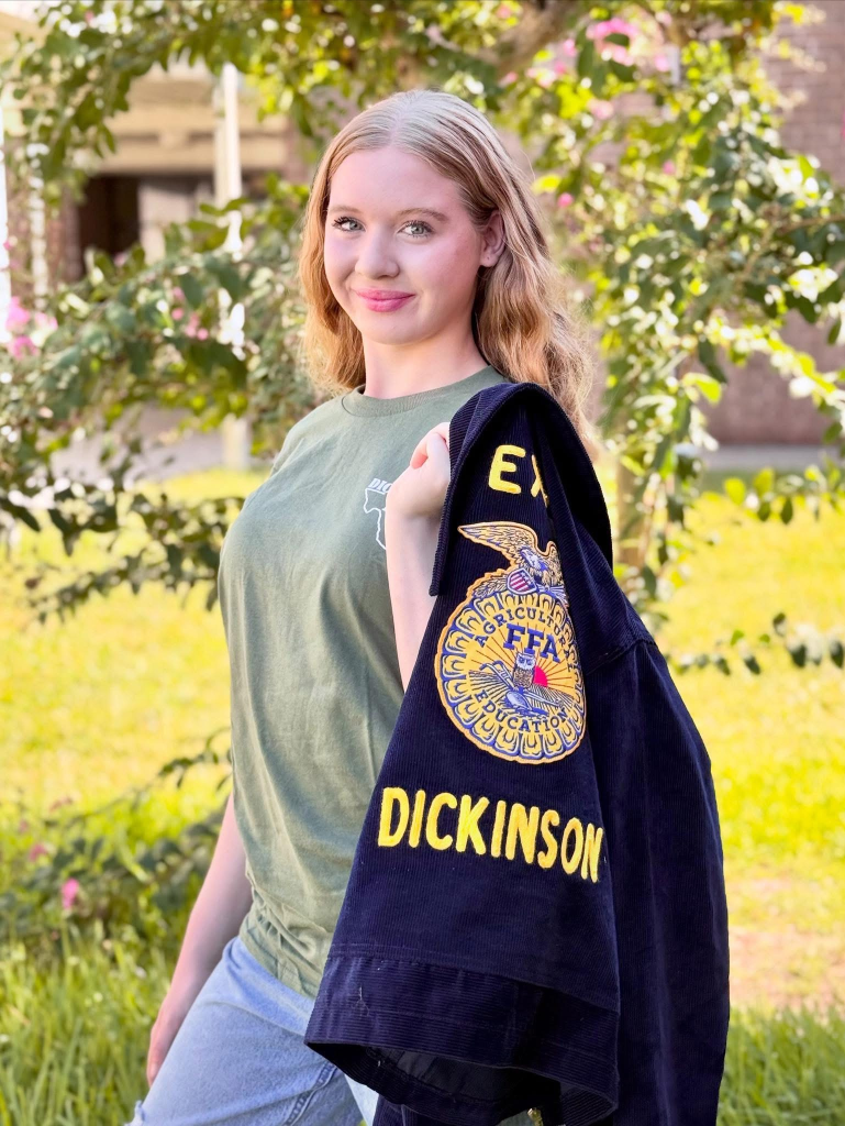 Jordan Emmitte proudly posed with her Dickinson FFA jacket.