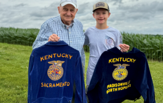 Cade King and his great grandfather Allen Whitmer holding their FFA Jackets