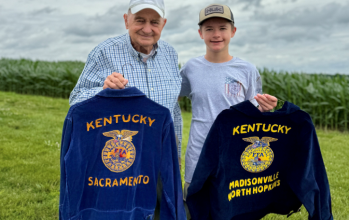 Cade King and his great grandfather Allen Whitmer holding their FFA Jackets