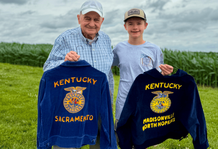 Cade King and his great grandfather Allen Whitmer holding their FFA Jackets