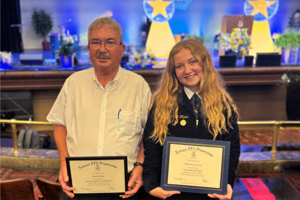 Gordon and McKenzie Wilson capturing their state degrees together.