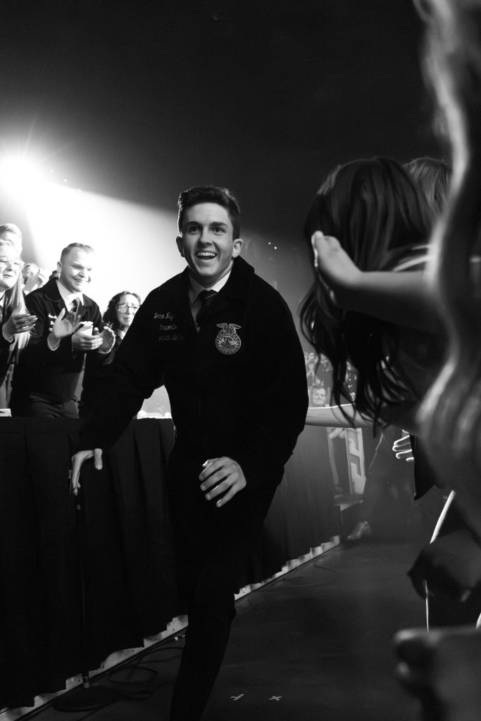 Jace Myers running onto the stage at the Oklahoma State FFA Convention after being elected.