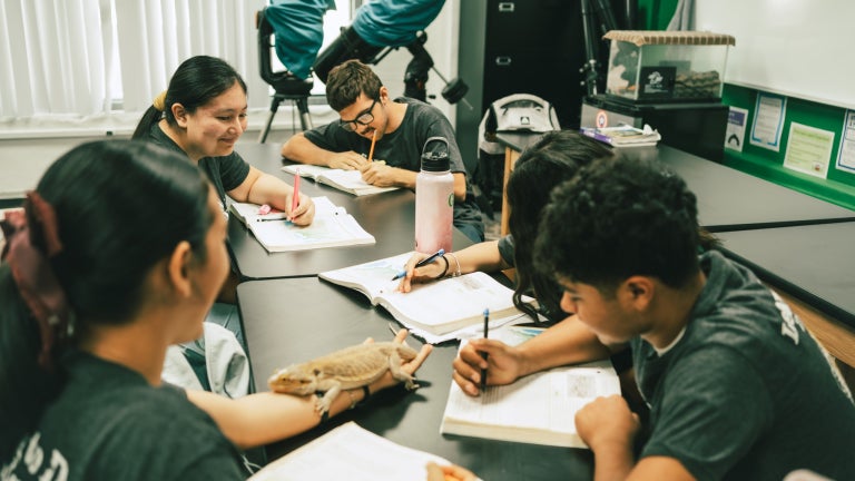 Students Study Together Around Classroom Table