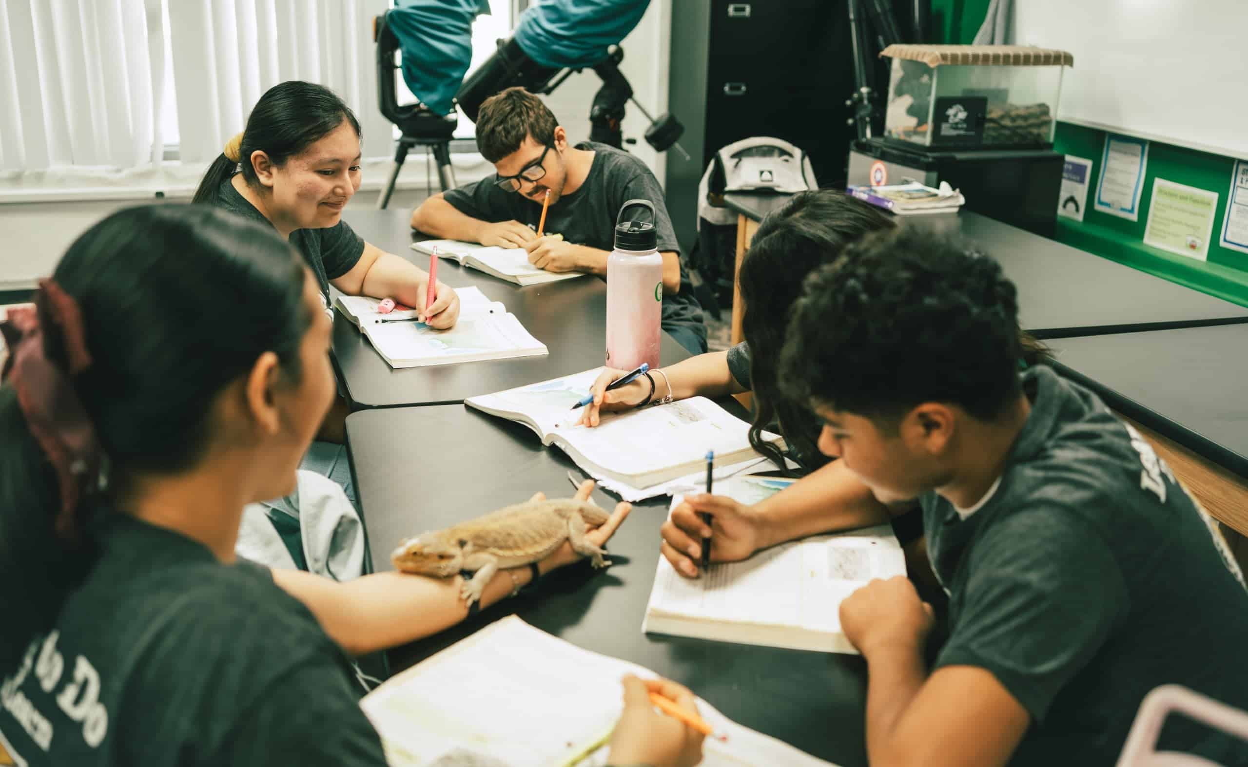 Students Study Together Around Classroom Table