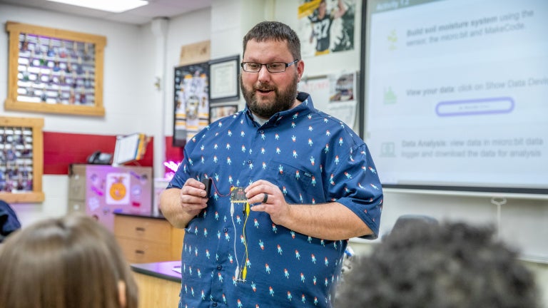 FFA Educator Demonstrates Agricultural Tool to Students