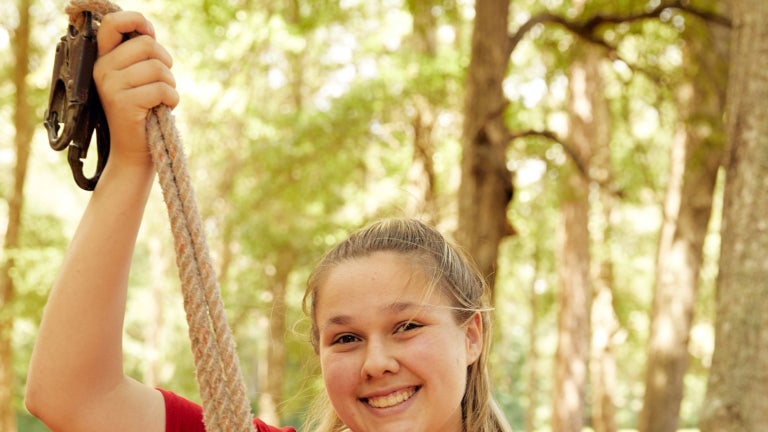 FFA Student Demonstrates Rope Climbing at SC Camp