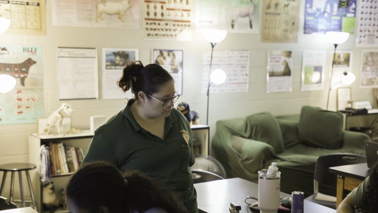 FFA Advisor Mentoring Students in Classroom
