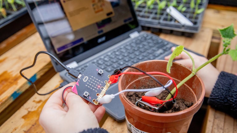 Student demonstrates plant sensor technology