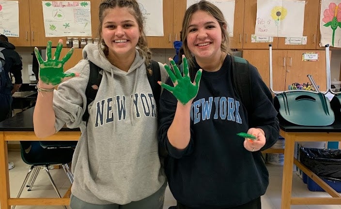 FFA members celebrate earning their greenhand degrees.
