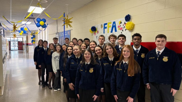 FFA members stand in the hallway in official dress