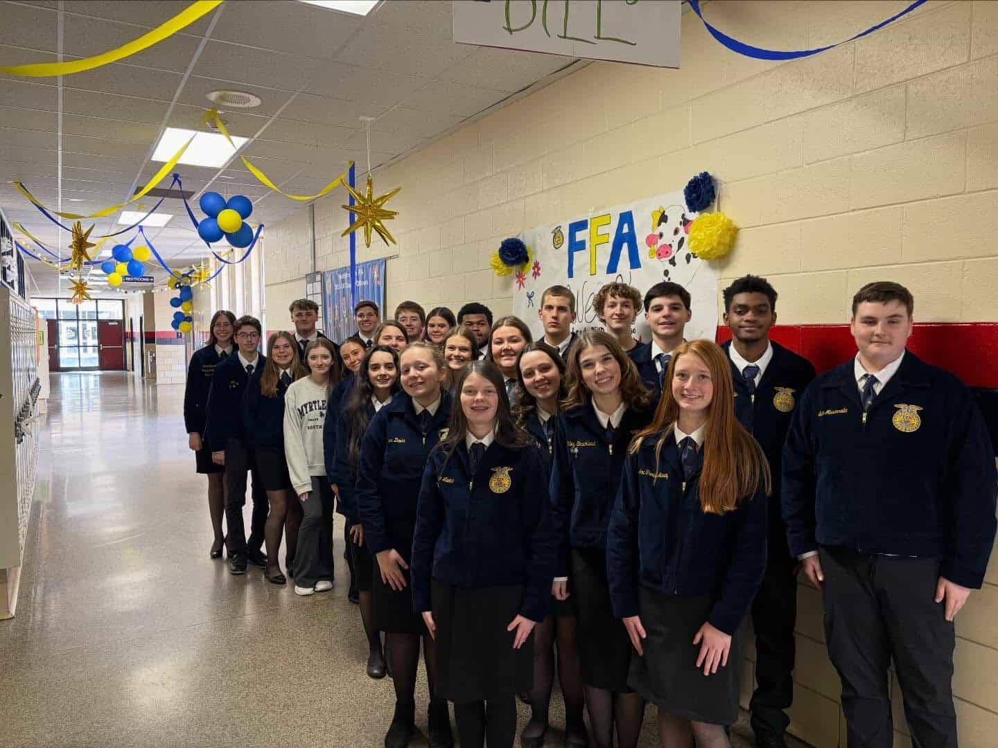 FFA members stand in the hallway in official dress