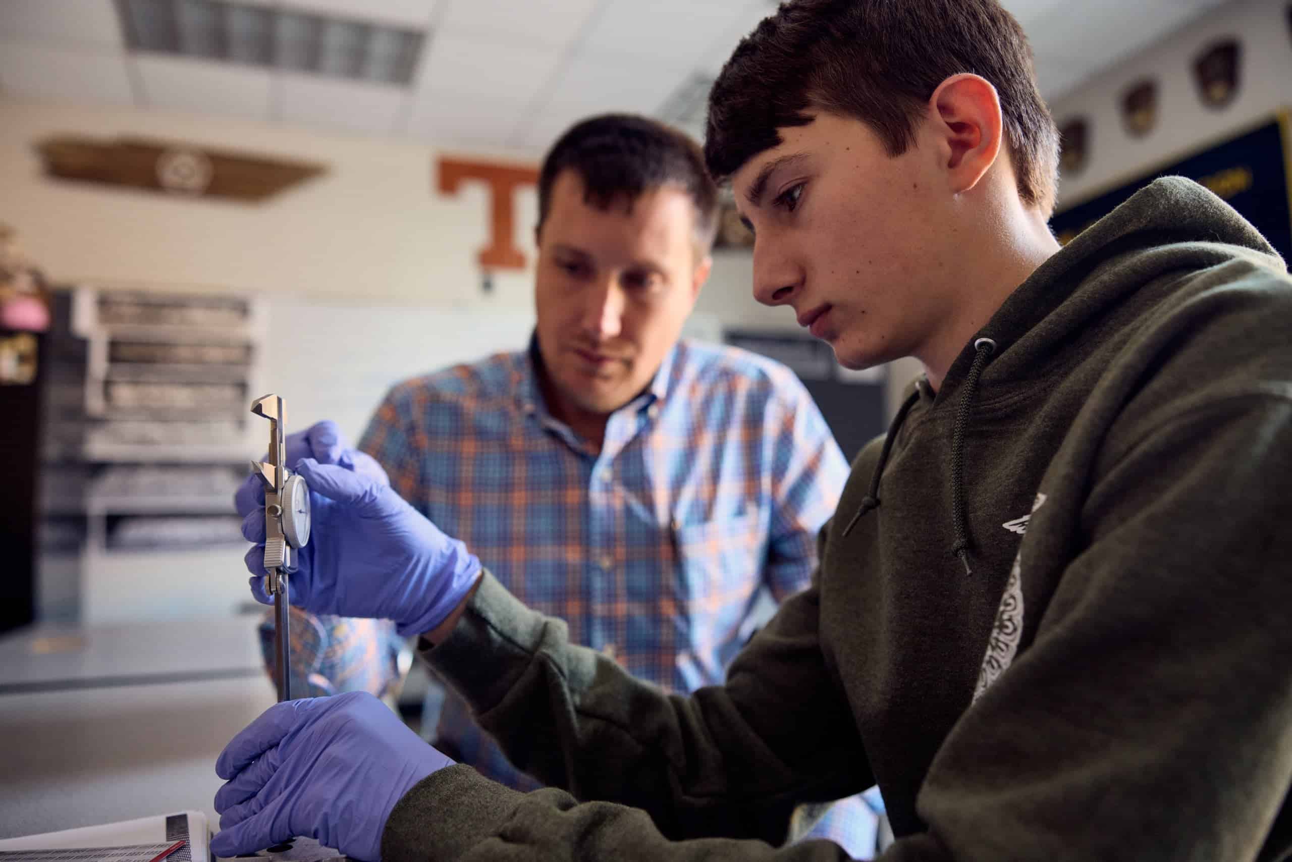 Student explores fire prevention equipment in lab setting