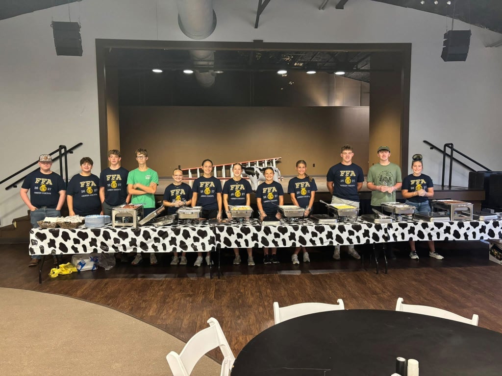Members of the 2026-2027 Green County FFA Chapter pause for a picture while getting ready to serve the community ham breakfast.