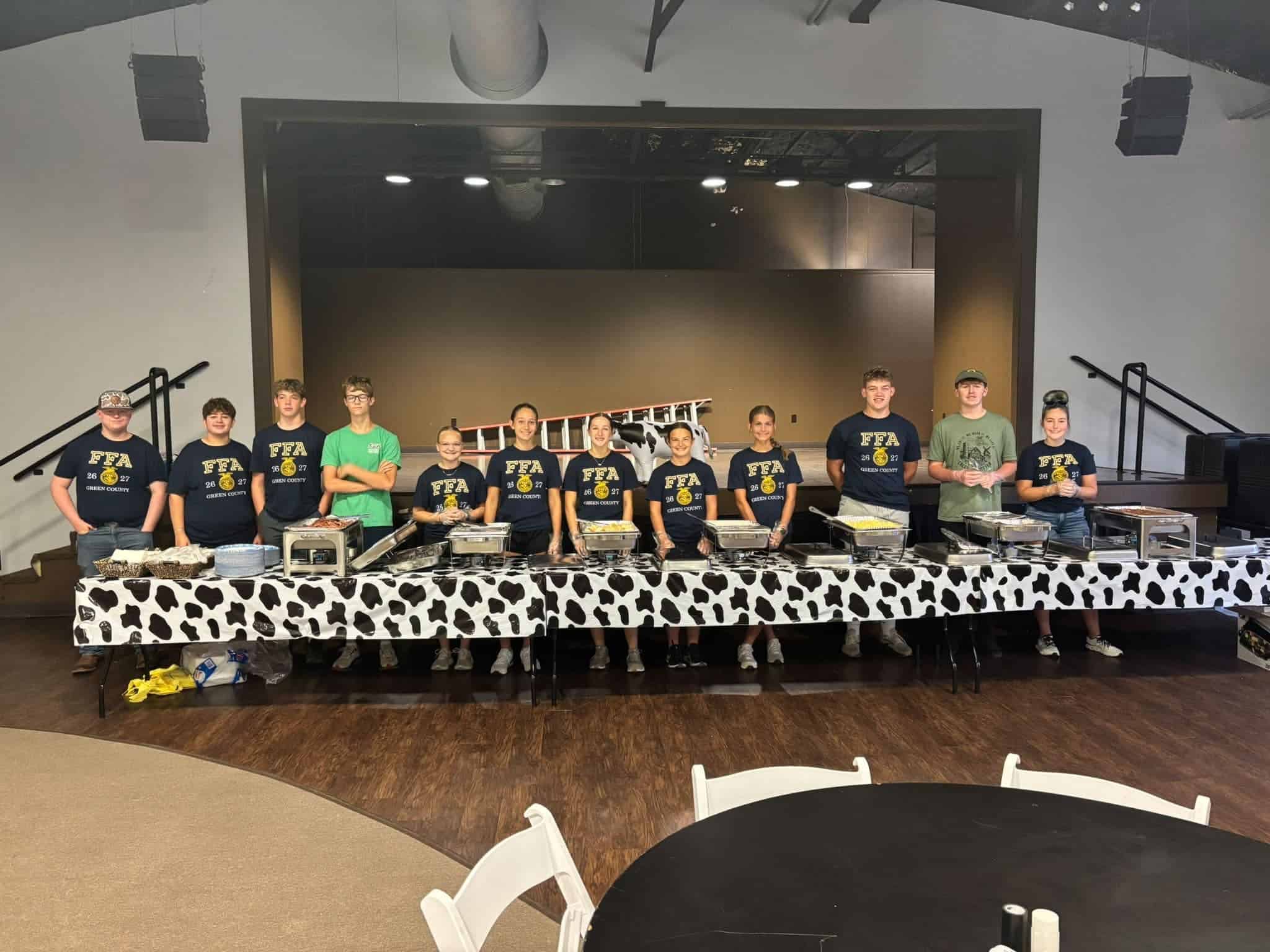 Members of the 2026-2027 Green County FFA Chapter pause for a picture while getting ready to serve the community ham breakfast.